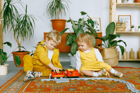 a child and child playing with toys
